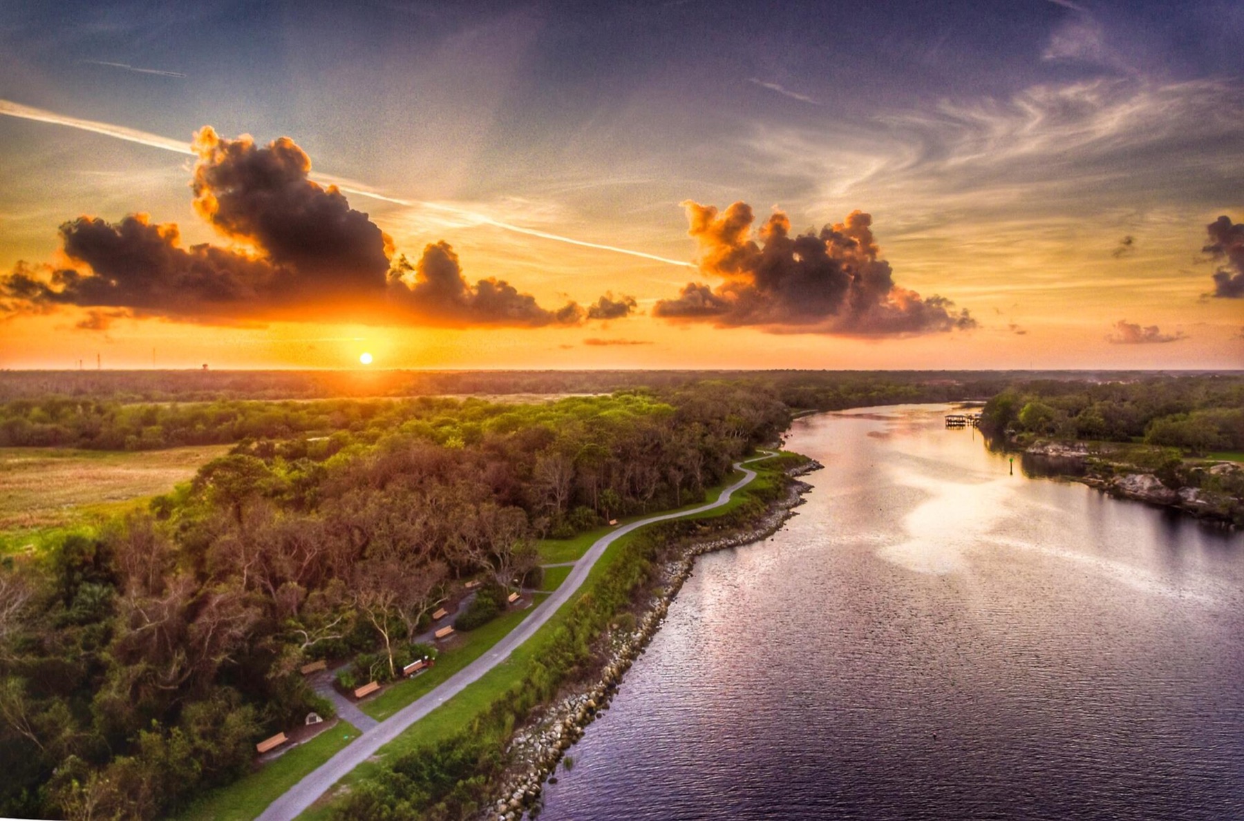 Sunset over a waterway and trail in Palm Coast Florida